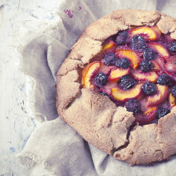 polaroid of whole french galette with sliced fruits
