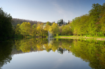 Fototapeta na wymiar Monastery on the hill by the pond