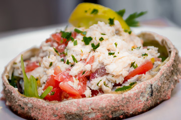 Crab salad served in the shell of spider-crab