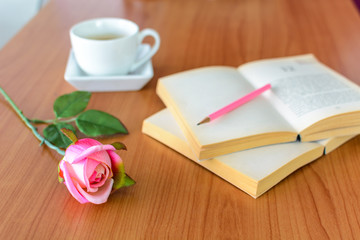 pink rose with book and coffee