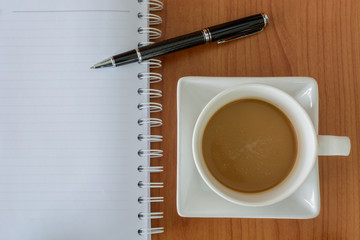 cup of coffee with notebook