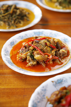 close up thai spicy pork curry in dish
