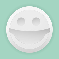 Closeup of a white pill with smile of happiness
