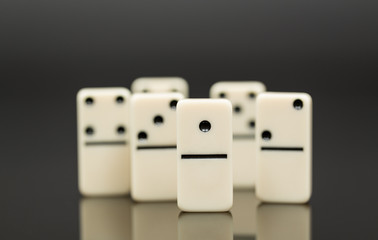 White dominoes showing leader or winner