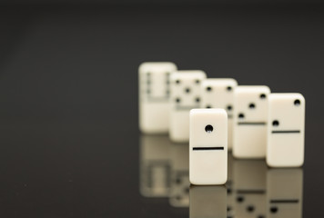 White dominoes showing leader or winner