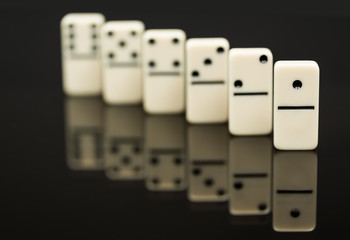 White dominoes showing leader or winner