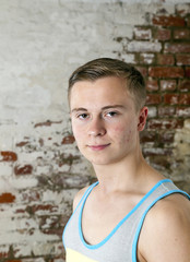 Portrait of a positive adolescent boy in puberty