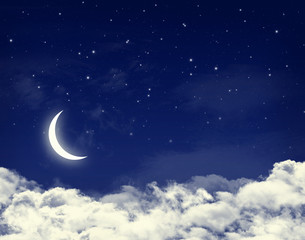Fototapeta na wymiar Moon and stars in a cloudy night blue sky