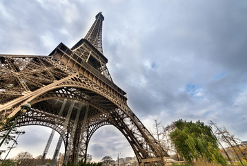 Fototapeta na wymiar Magnificence of Eiffel Tower, view of powerful landmark structur
