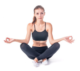 Young attractive woman meditates