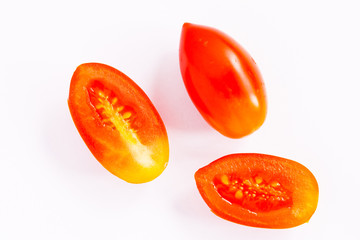 Grape or cherry tomatoes isolated on white background.