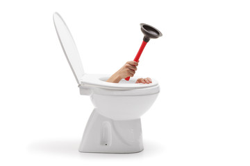 Hand with a rubber suction cup coming out from toilet bowl