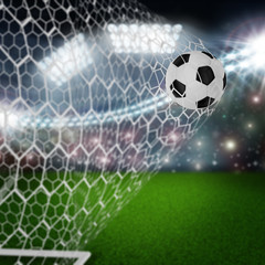 soccer ball in goal net