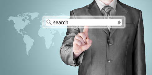 Businessman pushing virtual search bar