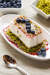  fancy panna cotta with blueberries and pistachio