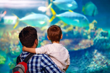 father and son in oceanarium
