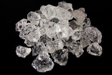 Beautiful Ice cubes. White crystals on a black background