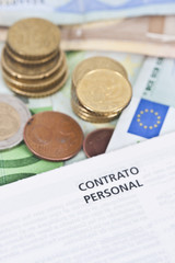 Closeup of the pen and contract leaf coins