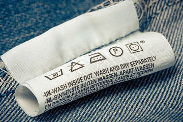 Label clothes  jeans blue background.