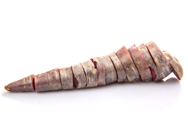 Chopped purple carrot over white background