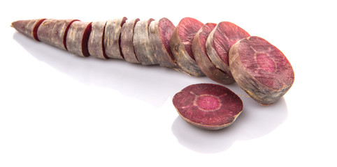 Chopped purple carrot over white background
