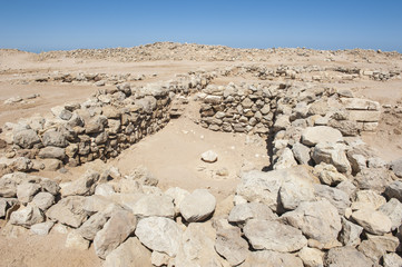 Old roman ruins on desert coastline