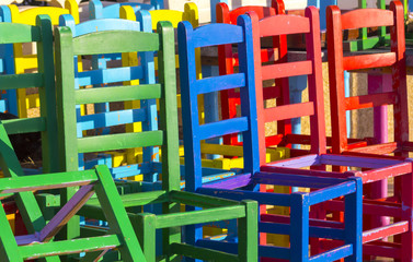 many chairs of different colors together