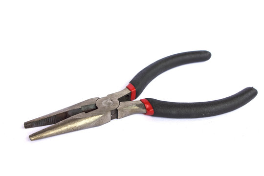 Rusty pliers over white background