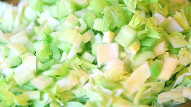 Closeup of cut green celery roots with cabbage