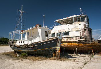 rusting boats at greek dockyard