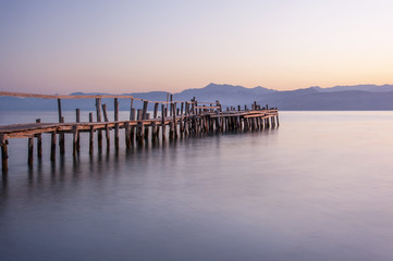 Obraz premium wooden planked jetty, greece