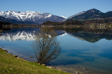 Fototapeta na wymiar Hallstatt Lake with Alps range background