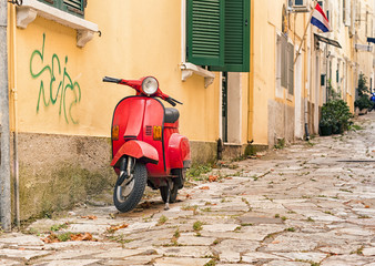 red moped on corfu town street