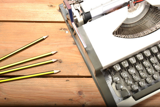 Typewriter and pencils