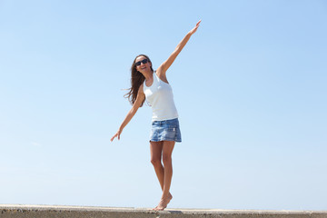 Young woman balancing walk walking outdoors