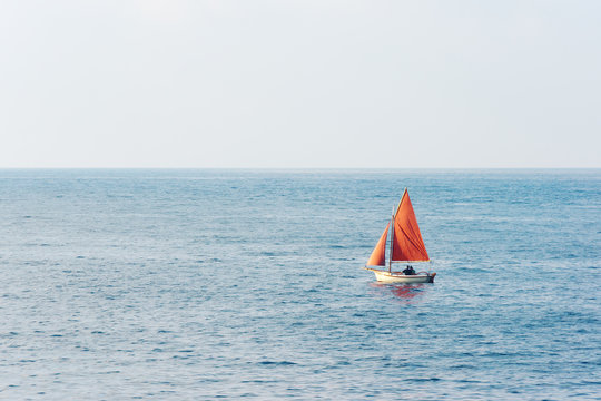 Fototapeta small sailboat on water