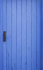 Blue shed door with locker
