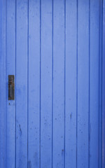 Blue shed door with locker