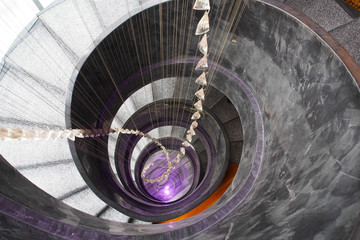 Top view of spiral stair that refer to the abstract and mysterious feeling like looking in to new dimension, or new space.
