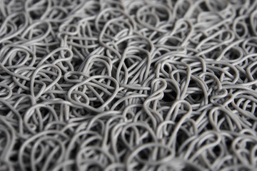 texture of random plastic line in grey color, the shot focus in the center of the picture