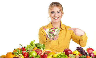 Young woman and groceries isolated on white