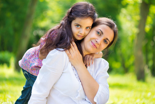 Pretty Mother With Daughter At Summer Park