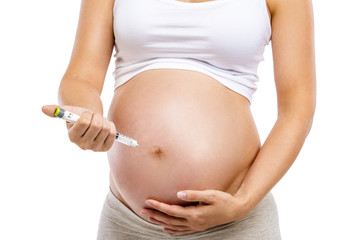 Pregnant woman with syringe