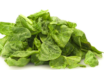 Fresh green leaves spinach on a white background