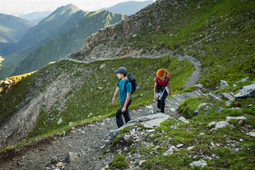 Fototapeta premium Mother and son hiking in the mountains