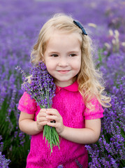 cute little girl holding a bouquet