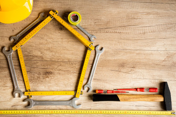 Different tools on a wooden background.