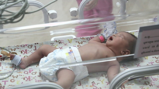 newborn baby in Incubator care at nursery