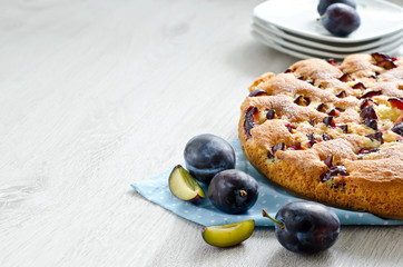 Cake with plums copyspace