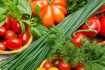 Composition of different varieties of tomatoes with herbs